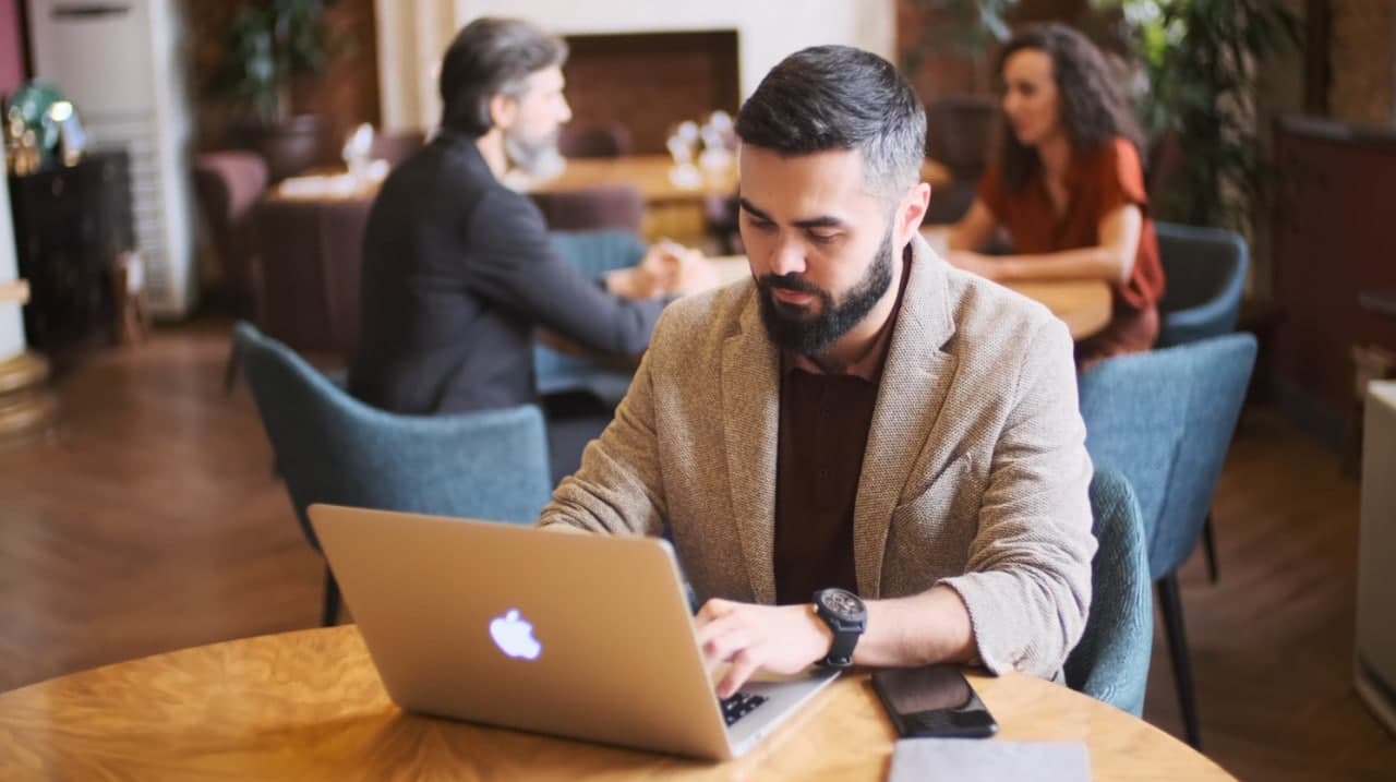 a-man-seated-with-a-laptop-on-starting-a-nonprofit-organization-corpify-inc