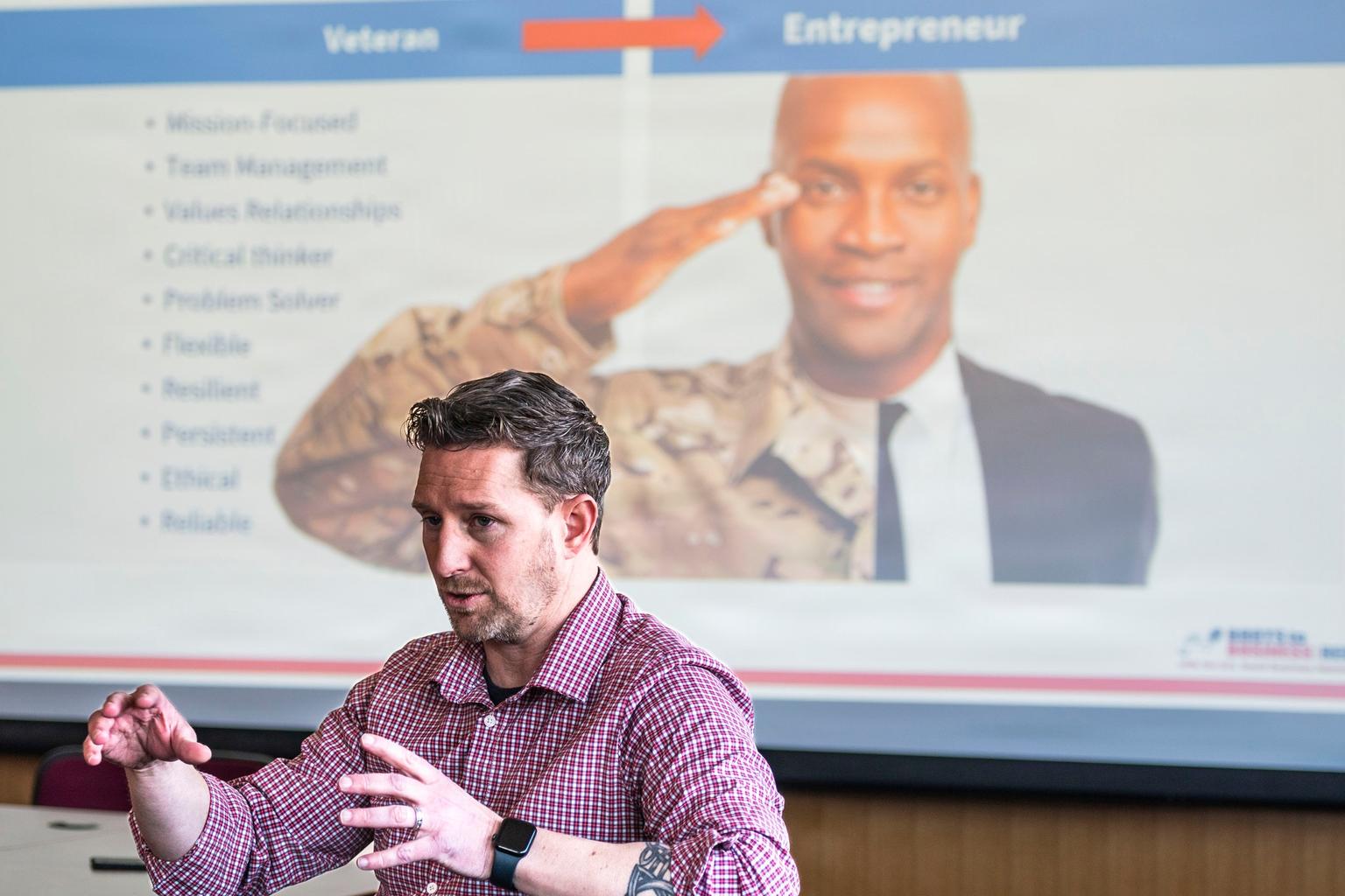 An instructor leads an SBA Boots to Business workshop for aspiring entrepreneurs at Pease Air National Guard Base in New Hampshire.