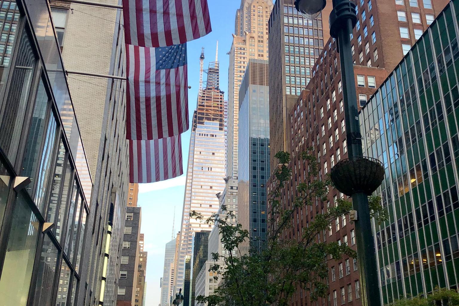 American flags hanging above a Manhattan street.