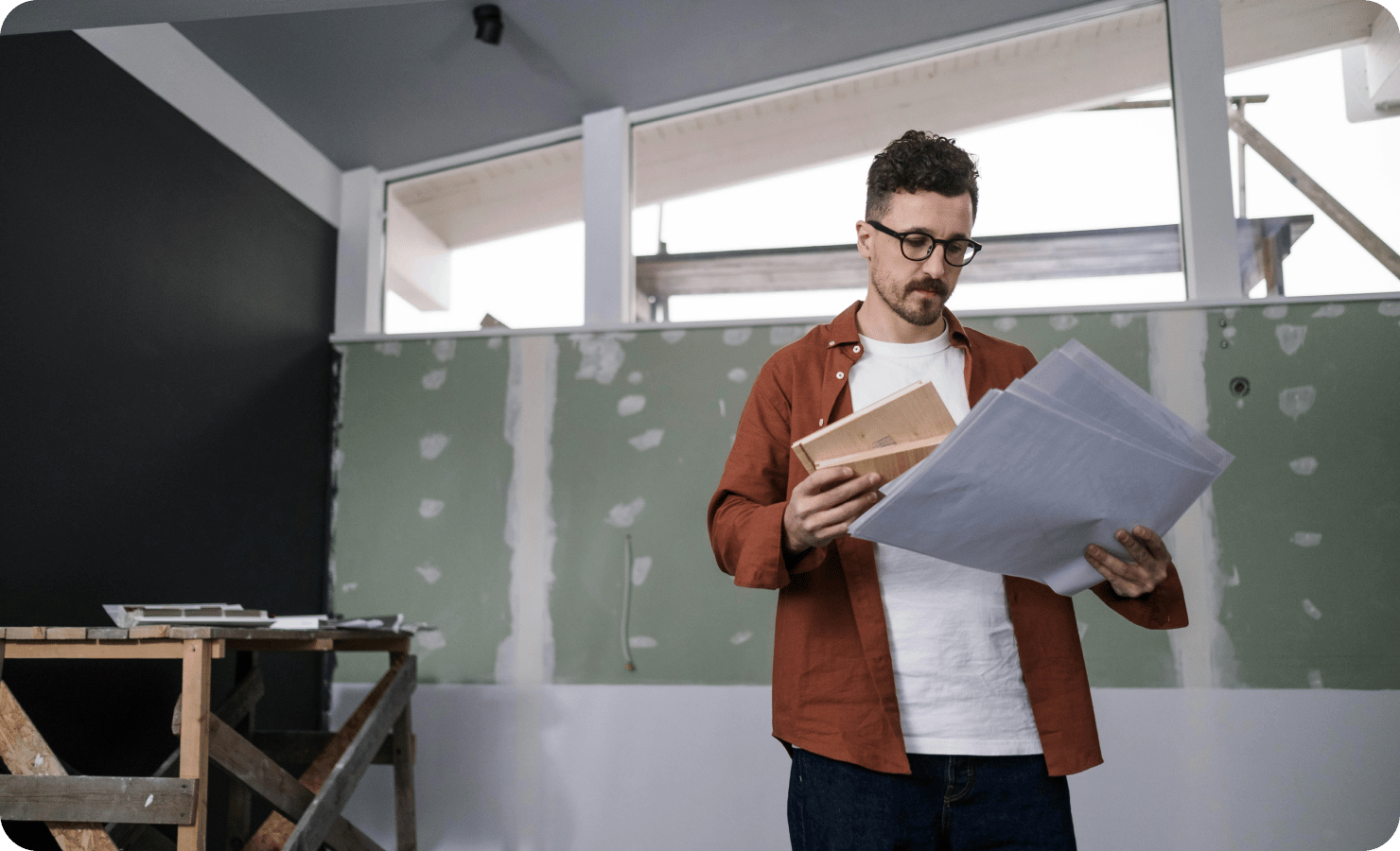 general-contractor-holding-blueprints-securing-llc-for-his-business-corpify-inc